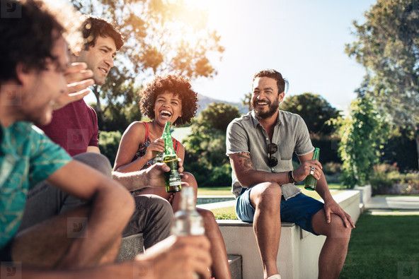 Young people having a party outside in backyard